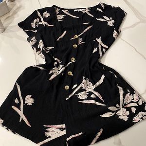 O’NEILL Black with white floral , one piece romper with side pockets